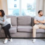 woman checking phone with no reply feeling emotional distance in relationship
