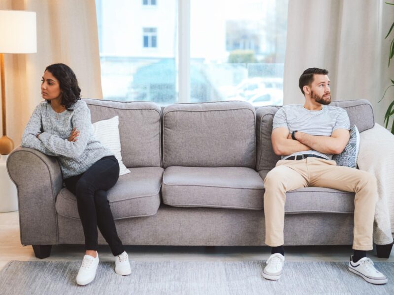 woman checking phone with no reply feeling emotional distance in relationship