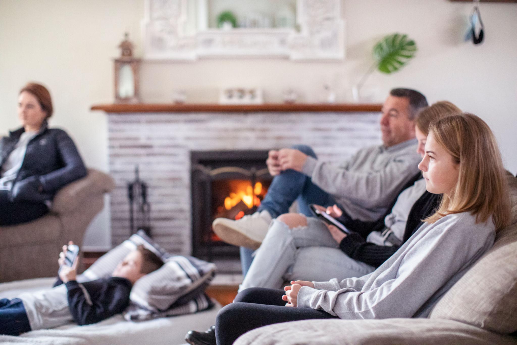 Family sitting together in a peaceful home environment showing protection and stability
