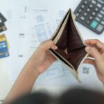 person stressed about financial problems and lack of money seeking guidance
