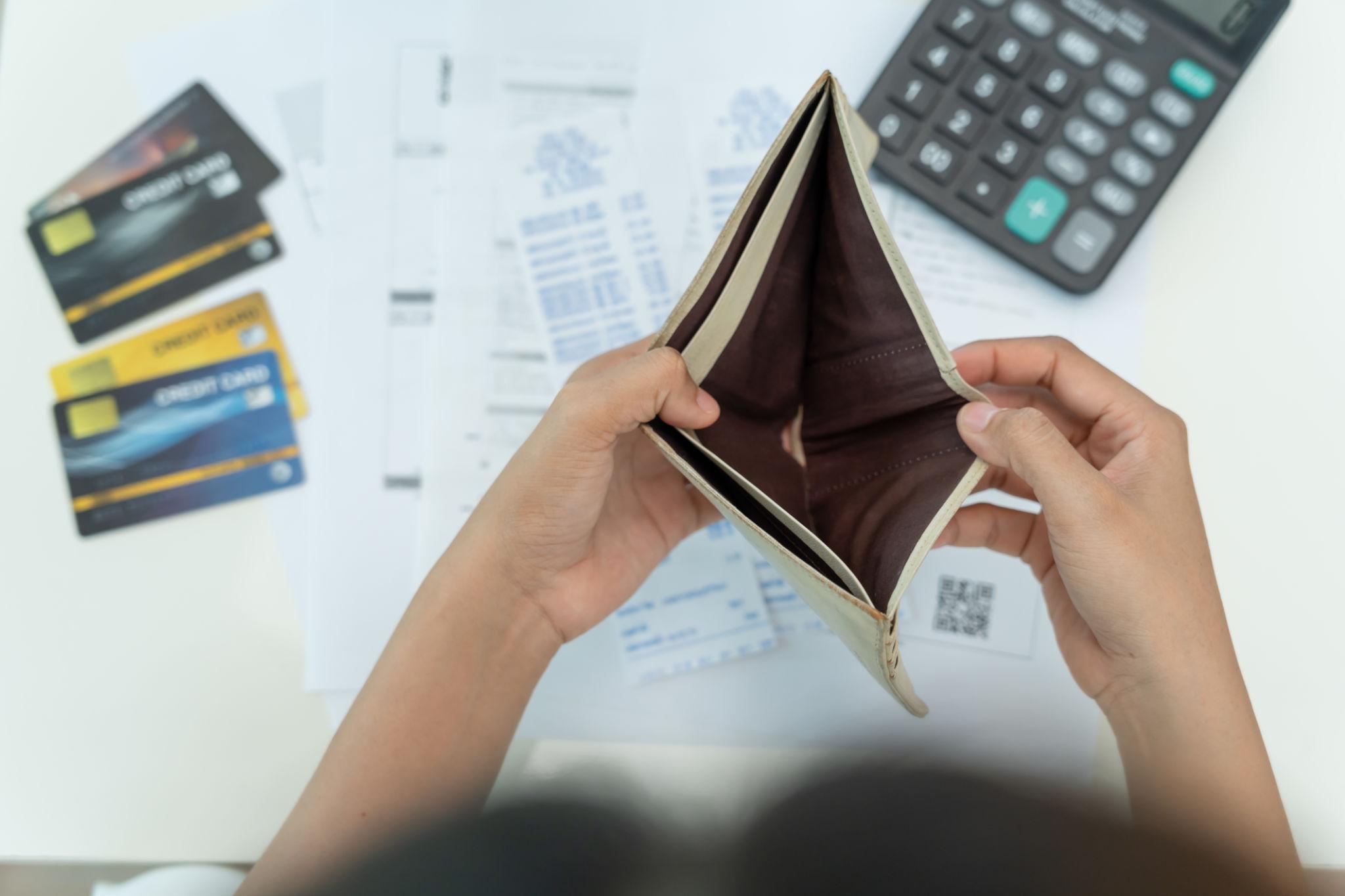 person stressed about financial problems and lack of money seeking guidance