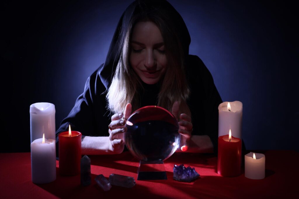 Psychic reading with crystal ball and candles