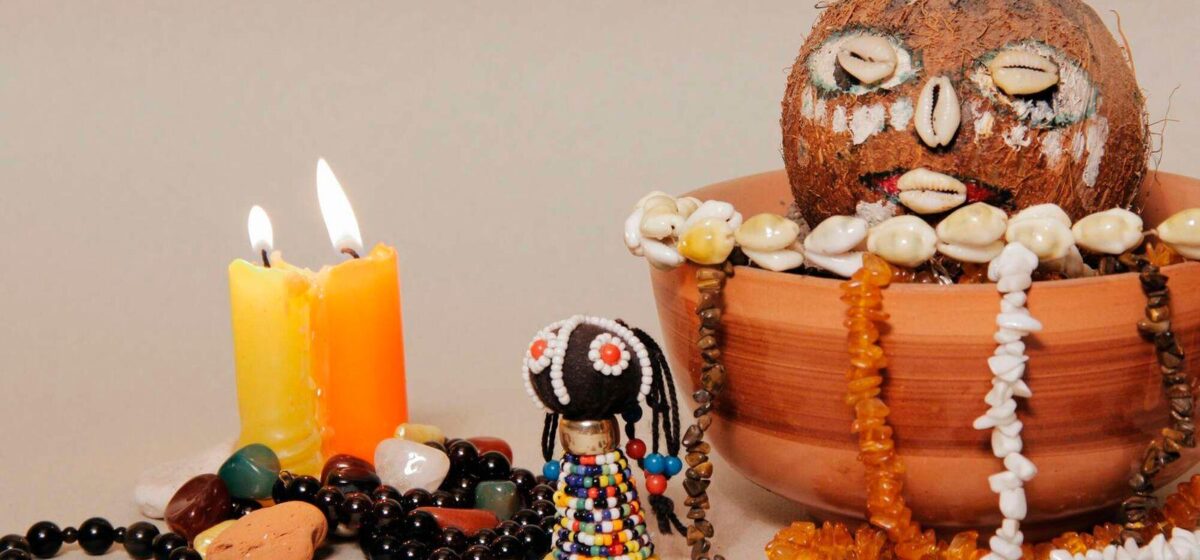African spiritual healer performing candle ritual for guidance and cleansing